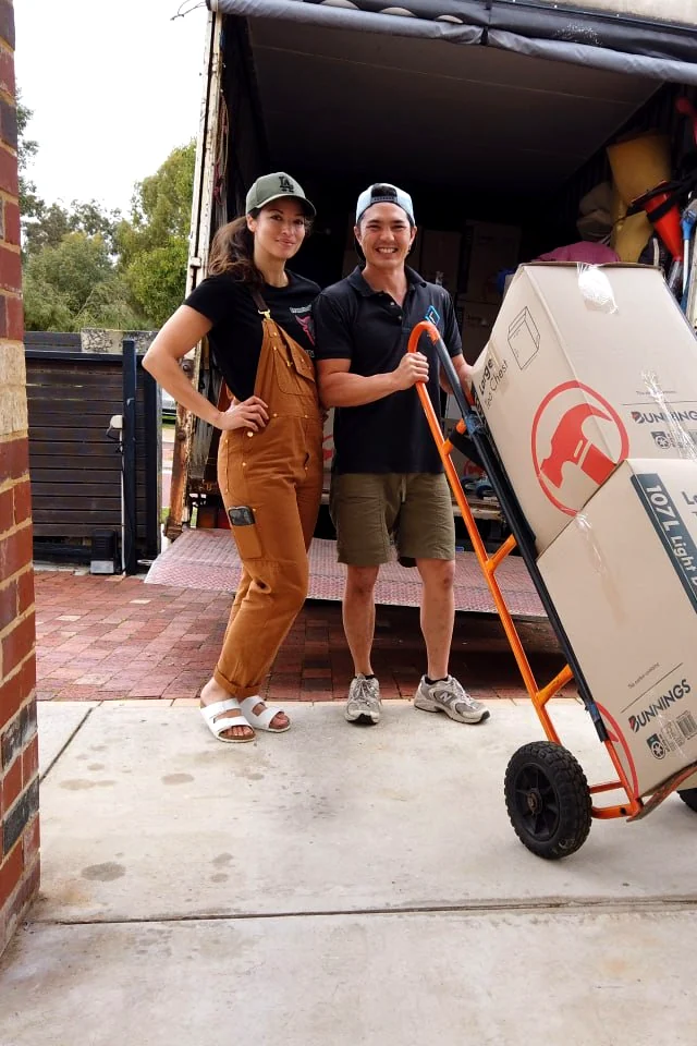 The Furniture Removalists Perth crew at the truck with a trolley of packed cartons