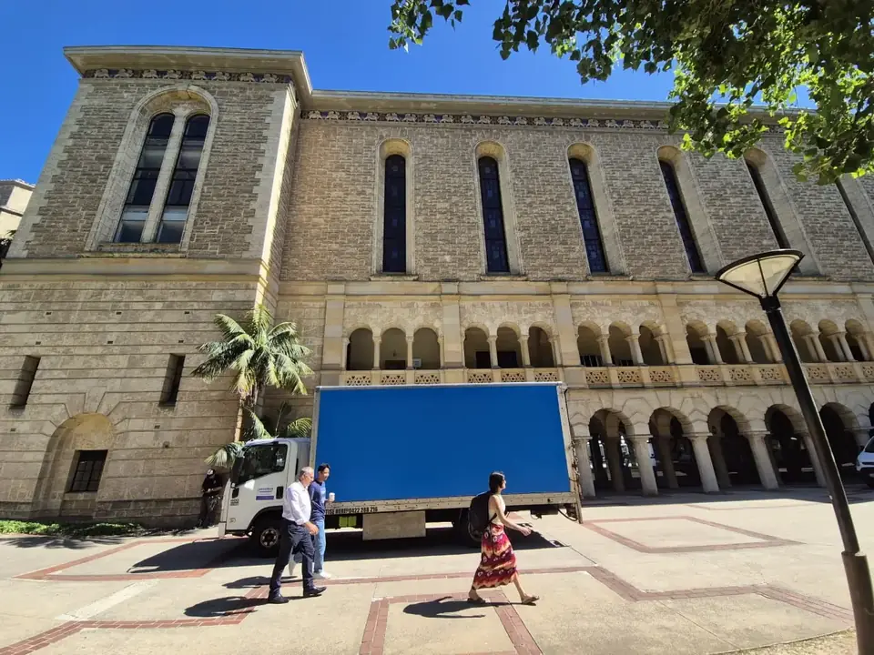 Furniture Removalists Perth moving truck parked outside a heritage Perth building on a job